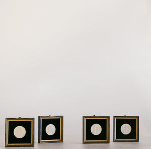 Set of four framed plaques molded after Neoclassical Danish sculptor Bertel Thorvaldsen’s “Four Seasons” entitled Childhood - Spring, Youth - Summer, Manhood - Autumn, and Old Age - Winter